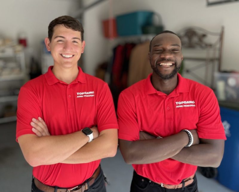 top dawg junk removal team smiling with arms crossed