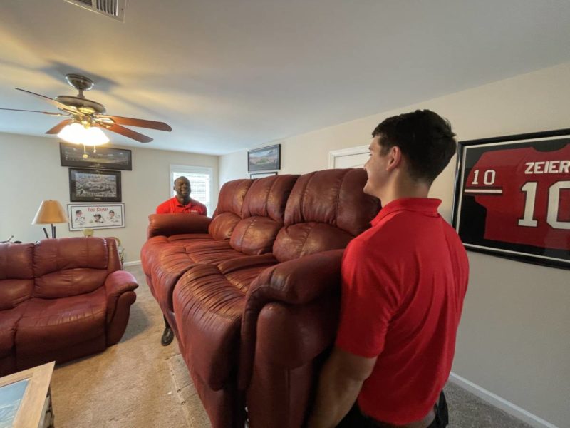 topdawg junk removal experts removing a couch